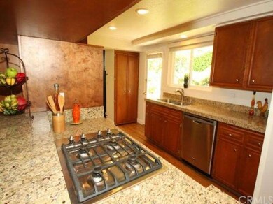 Beautiful kitchen with granite slab counters and s