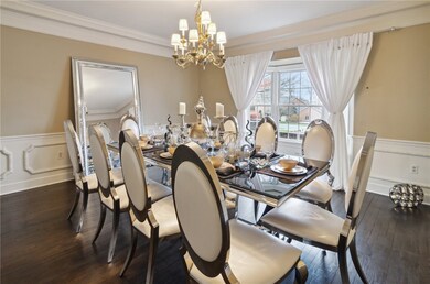 Elegant and spacious formal dining room with a lar
