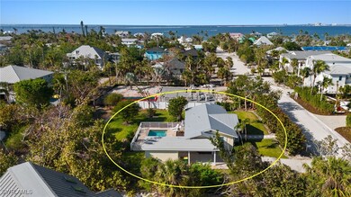 Drone / aerial view with a water view and a reside