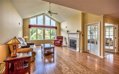 Impressive living room with cathedral ceiling and 