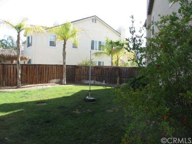 Southeast side of home with a large pool size yard