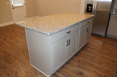 Example Photo of Finished Kitchen Island with overhang for counter height stools.