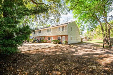 View of front of property with brick siding and di