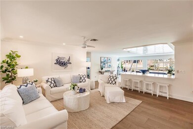 Living room with ceiling fan, hardwood / wood-styl