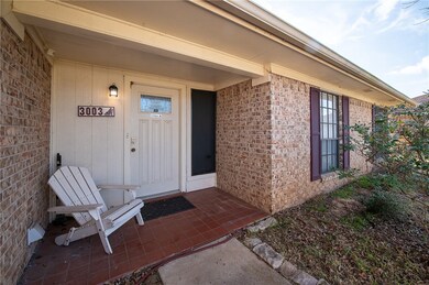Entrance to property with brick siding