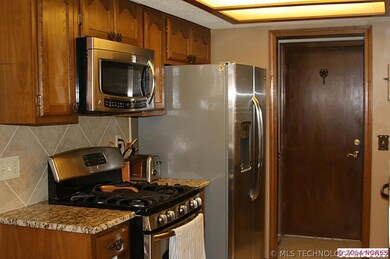 Updated kitchen with stainless steel gas range and