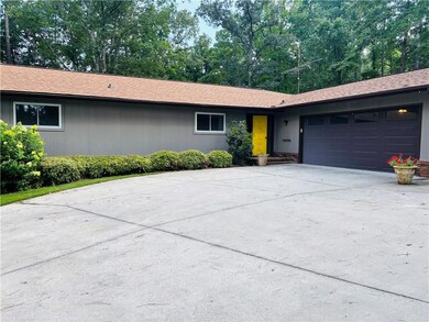 Ranch-style home with an attached garage and driveway