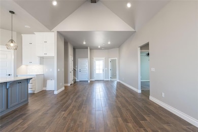 Unfurnished living room featuring a sink, a firepl