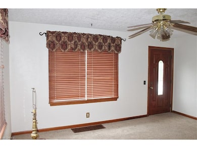 Carpeted Living Room, all window treatments convey