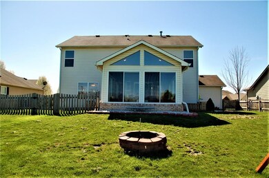 Back of the House with Large Sunroom, and Fully Fenced Back Yard.