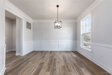 Unfurnished room with dark hardwood / wood-style f