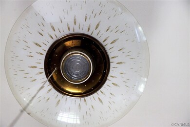 Cool vintage light in living room...no need for a landfill here!