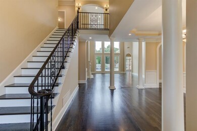 Sophisticated two-story entry welcomes you home.