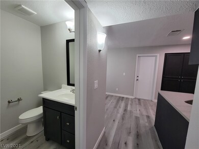 Downstairs half bath between living spaces and kit