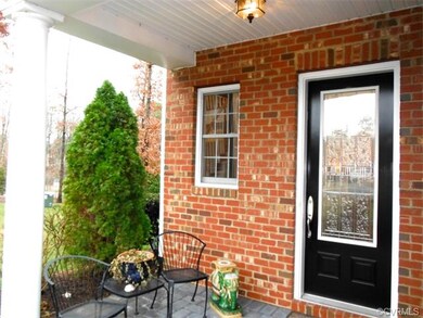 Covered front porch provides inviting entry, great
