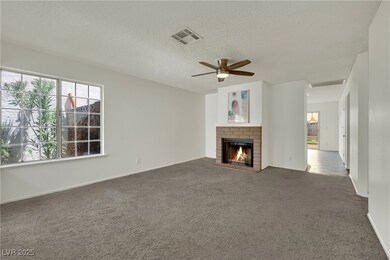 Unfurnished living room with carpet flooring, a te