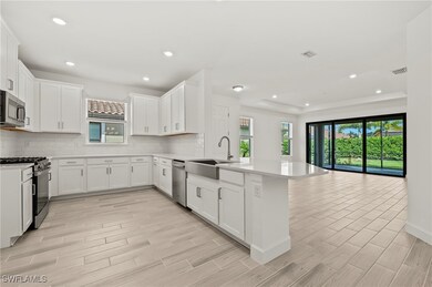 Kitchen featuring a sink, appliances with stainles
