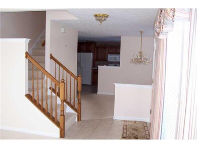 Kitchen. VIEW FROM LIVING ROOM SHOWING STAIRS TO L