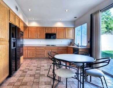 Sunny kitchen with easy access to backyard makes e