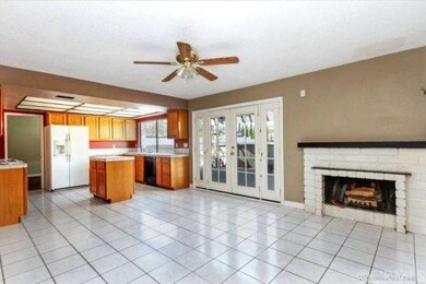 LARGE AND OPEN KITCHEN WITH WOOD BURNING FIREPLACE