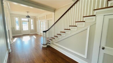 Foyer entrance with hardwood / wood-style floors a