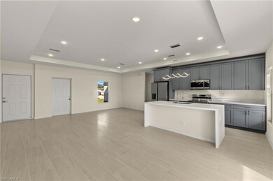 Kitchen with sink, appliances with stainless steel