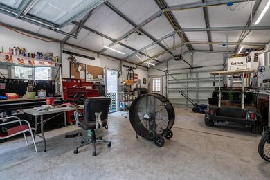 Insulated workshop interior with 220 amp service a