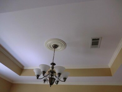 Vaulted Ceiling in the formal dining room with upd