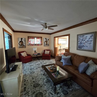 Formal living room with natural wood molding