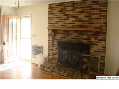 Den fireplace.