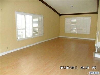 LIVING ROOM WITH PLANTATION SHUTTERS