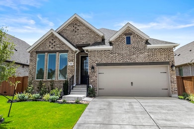 View of front of property featuring an attached g