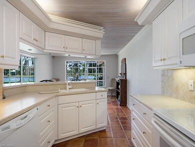 Kitchen and dining room also overlook the lake and