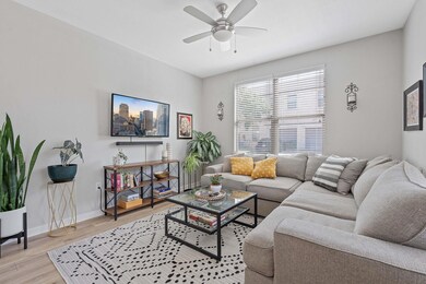 Living area with light wood-style floors and ceil