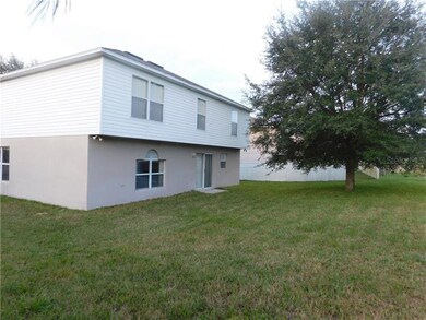 Rear Yard with large Oak tree