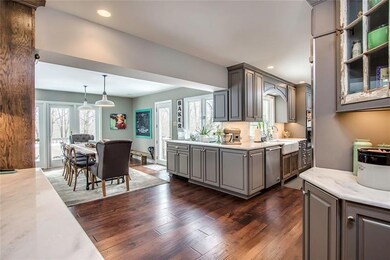 Newly Renovated Kitchen with Grey Cabinetry, Hardw