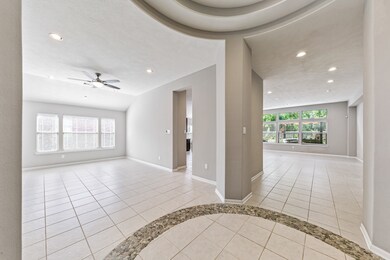 From the rotunda the view of the dining room and massive open concept living area.