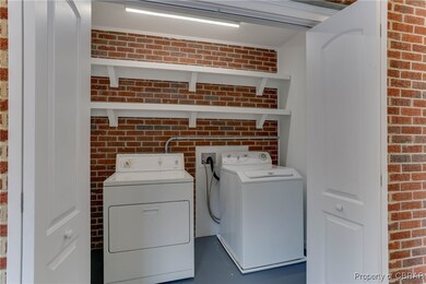 Laundry room featuring washer and clothes dryer an