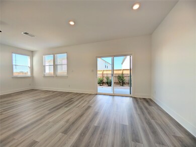 Empty room with recessed lighting and wood finish