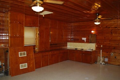 Tons of cabinets  and rustic car siding add versat