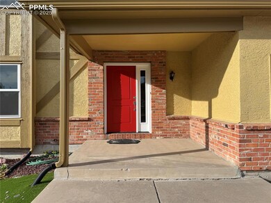 Doorway to property featuring stucco siding and br