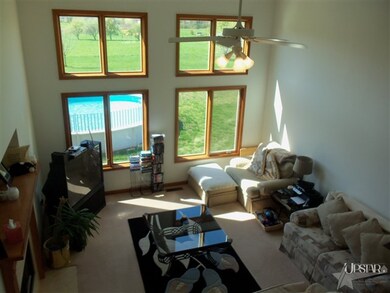 The Great Room has a 2 Story Ceiling with a Wall o