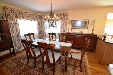 LARGE DINING ROOM WITH REFINISHED HARDWOOD FLOOR.