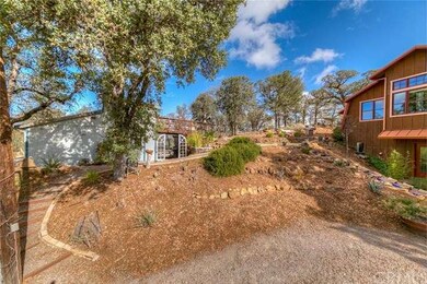 Landscaped pathway leads to oversized 2 car garage