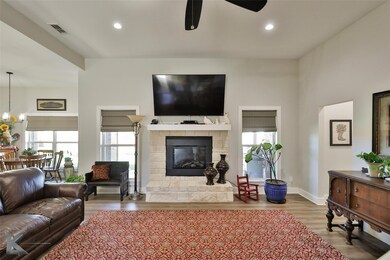 Living room featuring with a wealth of natural lig