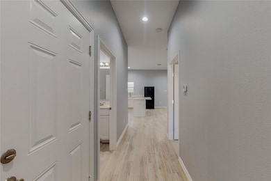 Hall featuring light wood-type flooring