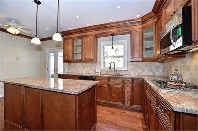 Kitchen boasts maple cabinetry, soft close cabinet