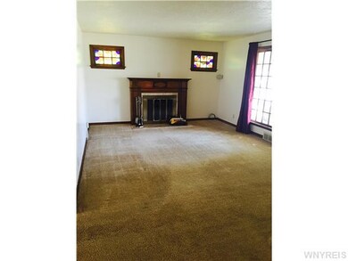 Living Room living room has stained glass windows
