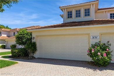 View of front of house featuring a garage, a tiled