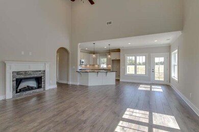 Open living, eat in and kitchen area with fireplace. 